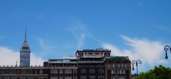 Low angle view of buildings against blue sky