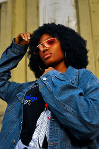 Portrait of young woman wearing sunglasses