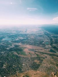 Aerial view of agricultural field against sky