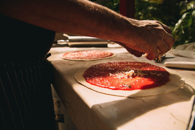 Midsection of man preparing food