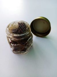 High angle view of glass jar on table