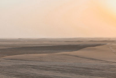 Scenic view of sea against sky at sunset