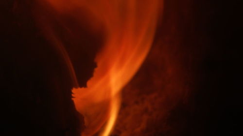 Close-up of emitting smoke at night