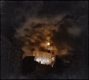 Low angle view of old building against sky at night