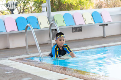 Full length of boy in swimming pool