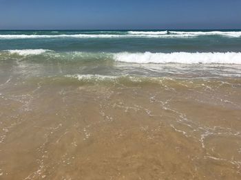 Scenic view of beach against sky