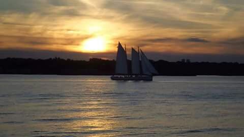 sunset, water, waterfront, silhouette, sky, orange color, reflection, sun, scenics, beauty in nature, transportation, tranquil scene, tranquility, nautical vessel, cloud - sky, sea, nature, built structure, architecture, river