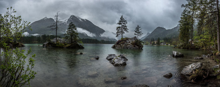 Panoramic view of lake and trees against sky