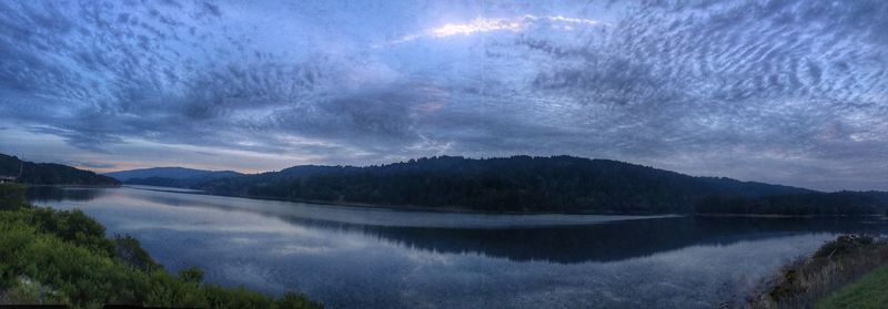 Panoramic view of lake and mountains against sky