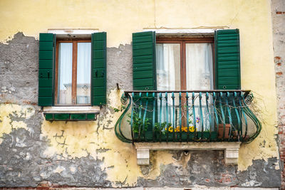 Low angle view of window on old building