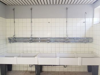 Close-up of white pipes on wall