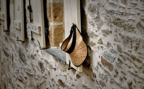 Close-up of shoes hanging on wall