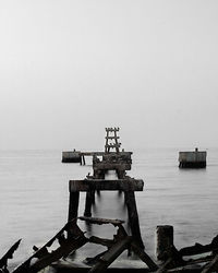 Lifeguard hut on pier against clear sky