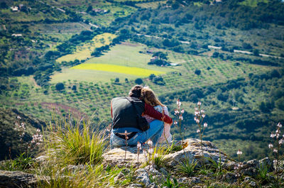 Couple overlooking countryside landscape