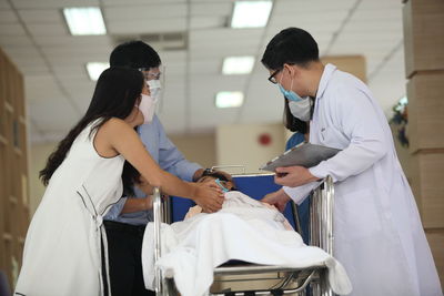 Doctors with patient in hospital