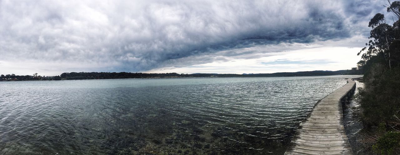 PANORAMIC SHOT OF CALM SEA AGAINST CLOUDS