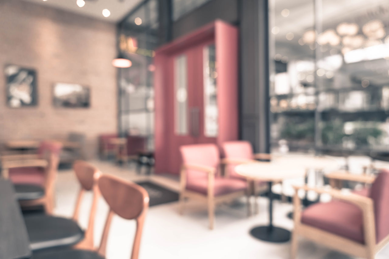 EMPTY CHAIRS AND TABLES IN RESTAURANT