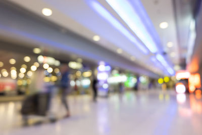 Defocused image of illuminated lights at railroad station