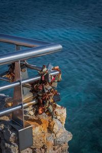 High angle view of rusty metal by sea