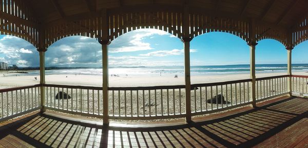 Scenic view of sea against sky seen through window