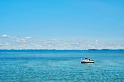 Calm sea with sailing boat in sunny danmark 