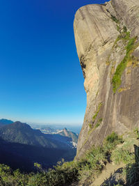 Scenic view of mountains against clear blue sky