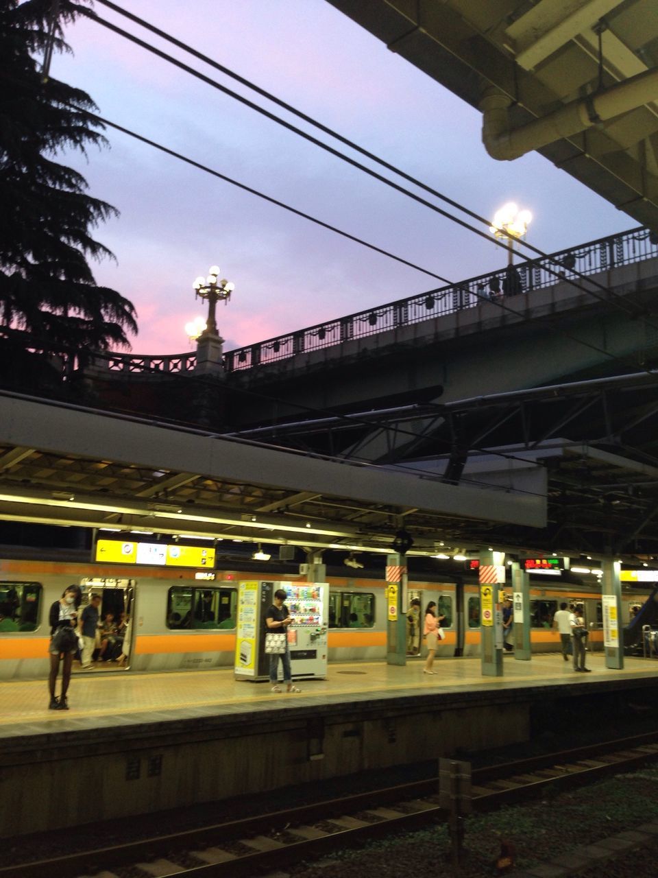 transportation, railroad track, rail transportation, public transportation, railroad station platform, railroad station, train - vehicle, mode of transport, passenger train, train, travel, built structure, architecture, power line, land vehicle, sky, connection, public transport, electricity pylon, journey