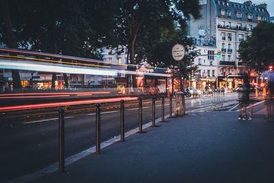 Light trails on street at dusk