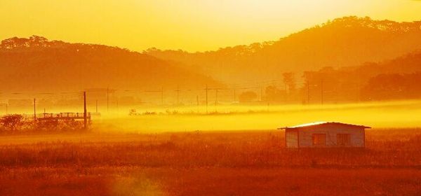 Scenic view of landscape at sunset