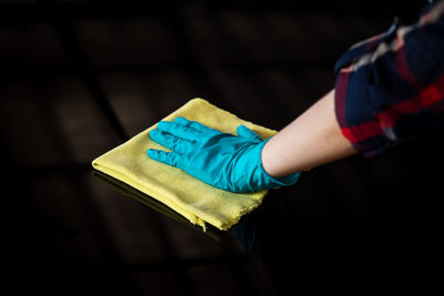 Close-up of hand holding umbrella