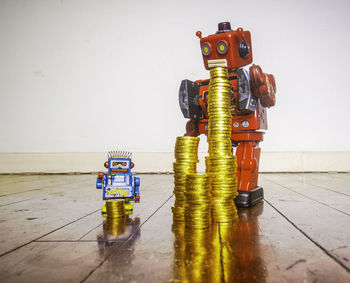 Close-up of toys on table against white background