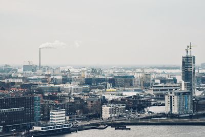 High angle view of buildings in city against sky