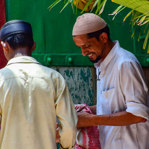 Man wearing hat standing outdoors