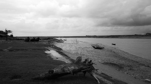 Scenic view of sea against cloudy sky