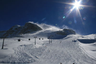 Low angle view of snow covered mountain against sky