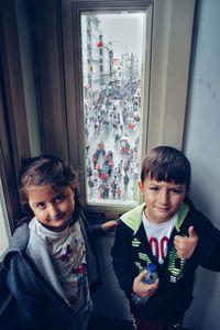 Portrait of boy and girl at home