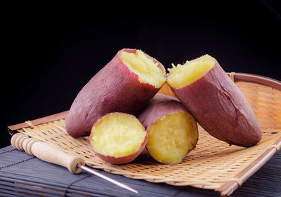 Close-up of fruits in basket on table