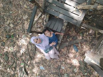 High angle view of boys sitting on floor