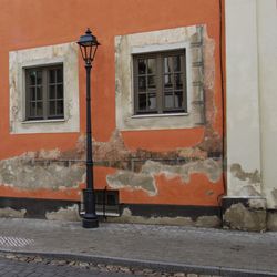 Street light against building in city