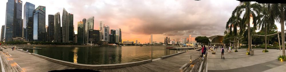 Panoramic view of city against cloudy sky