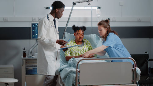 Doctor examining patient in hospital