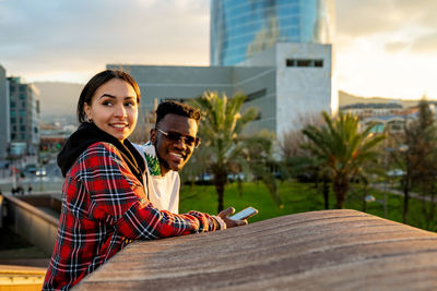 Portrait of smiling young couple outdoors