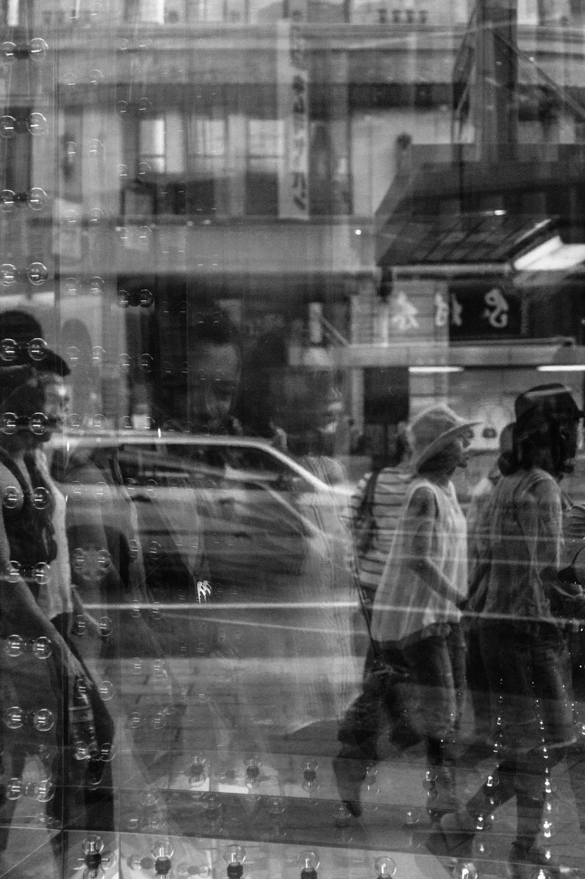 water, reflection, wet, rain, motion, transparent, transportation, glass - material, built structure, blurred motion, architecture, mode of transport, street, fountain, drop, building exterior, window, monsoon, city