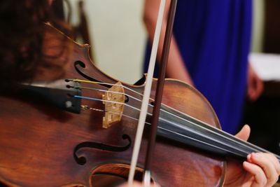 Close-up of person playing violin