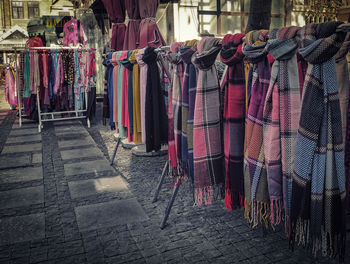 Row of multi colored hanging at market stall