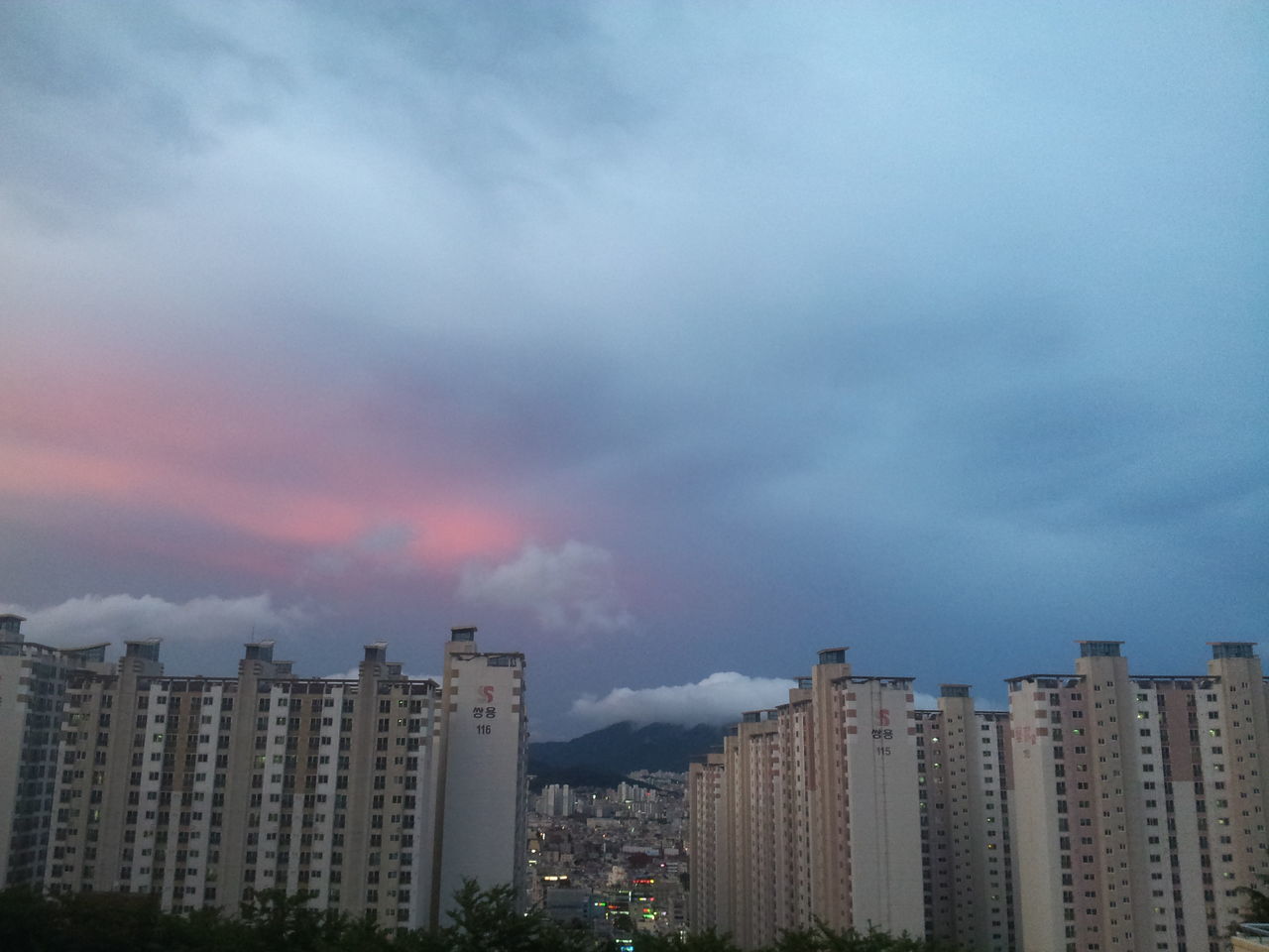 building exterior, architecture, built structure, city, sky, cloud - sky, cloudy, cityscape, weather, overcast, cloud, skyscraper, residential building, residential district, residential structure, storm cloud, outdoors, modern, no people, tower