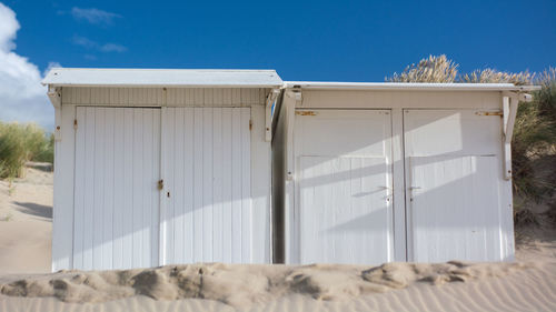 White building against blue sky on sunny day