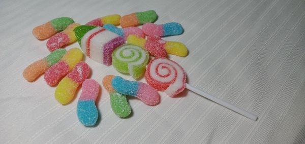 High angle view of multi colored candies on table