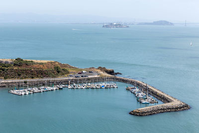 High angle view of sailboats in sea against sky