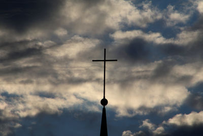 Low angle view of street light against cloudy sky